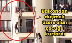 Düşmek üzere olan çocuğa ulaştı